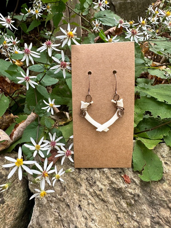 handmade earring with wire and animal bone