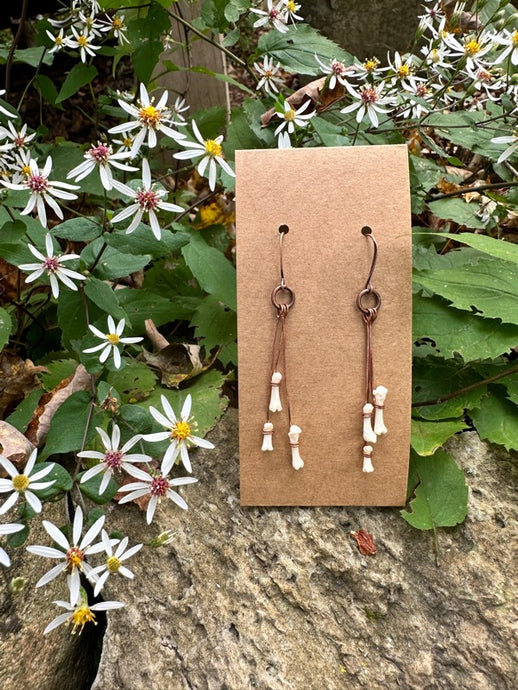 handmade earrings with copper and animal bones