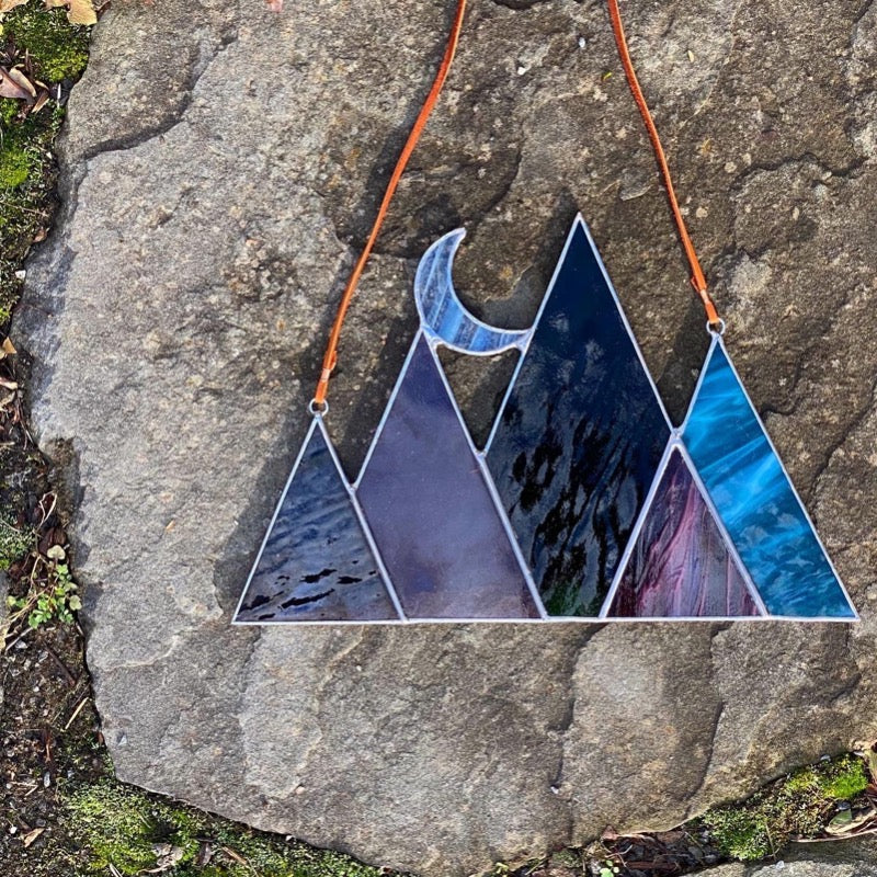 Stained glass mountain and moon home decor. Handmade stained glass art created by artist Carrie Root of the Root Studio in Addison Vermont.