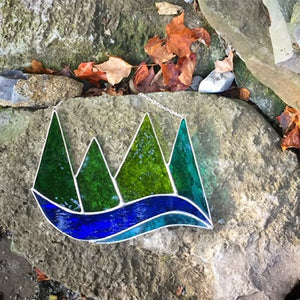 green mountains and lake stained glass handmade by artist carrie root of the root studio in addison, vermont